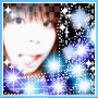 A pixelated image of a person with a bright white face, brown hair, and a blue and purple sparkly background with stars.