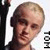 Pixelated static image of a person with light brown hair, dark eyebrows, and visible facial features against a white background.