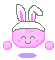 Pixelated pink spherical character with white bunny ears, smiling face on left frame and X-shaped eyes on right frame.