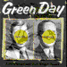 Green Day text appears above a of images showing various visual states of two figures with yellow circular face masks, a cartoon character, and a band performing on stage