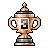 Pixel art trophy with dual handles, metallic copper and silver tones, central black-and-gray symbol on front, top finial, and base on solid gray background.