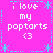 A static icon with a bright pink background displays repeated text and symbols in white and light blue pixels.