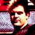 Animated contact sheet showing two frames of a pixelated character with dark hair and maroon clothing against red and purple backgrounds, alongside a diagonal CoolBuddy.com logo on blue background.