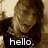 A four- shows a person in brown hair and dark clothing with text overlays: 'hello,', 'astronaut.', '<3', and empty space