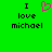 Green background with black text reading "I love michael" on both sides of a pink pixelated heart symbol.