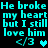 Cyan pixelated text on black background repeats 'He broke my heart but I still love him' with heart symbols and '</3' emoticons, arranged in two mirrored with slight variations in heart pixelation