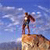 Pixelated static image of a figure on a rock face against a blue sky with clouds, appearing to be an alpinism-themed buddy icon.