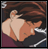 Pixelated image of a person with brown hair covering their face with one hand, next to text reading 'AnimeIM.com' on a black background.