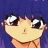 Pixelated anime-style character with blue hair and large eyes, next to black background with white text reading 'AnimeIM' and 'com'.