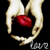 Two hands hold a red apple against black background with 'love' text below; one hand's fingers shift position across frames.