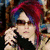 A four- shows a person with red and blue hair holding a phone, with text overlays reading "Forget it skittles." and "I am the RAINBOW"