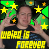 A person in a black shirt with yellow text poses against a green and black starry background with yellow and orange stars.