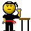 Pixelated character with yellow face, black shirt, red sash, and black pants performs sequential actions near a table with brown top and black legs.