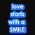Blue text blocks on black background read 'love starts with a SMILE' and 'then a KISS then a', with blue butterfly graphic below.