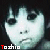 Six identical display a pale, wide-eyed child with dark hair and heavy eye makeup against black background; text "Toshio" appears in red-and-white pixelated font beneath each