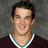 A pixelated image shows a person in a dark maroon shirt with green and white trim, standing against a gray background. Pink text reads "I LOVE me O'Br...