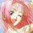 A pixelated anime-style character with pink hair and green eyes on the left, next to a black background with white text reading "Anime IM" above smaller stylized text "COM" on the right.