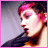 Pixelated of four views showing a person with pink hair and dark clothing, with partial text overlays in pink