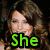 A four- displays a woman with long brown hair and a man in blue clothing, with green text reading "She is Awesome" across the
