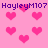 Pixelated pink background with scattered heart shapes and repeated text "HayleyM107" in dark purple, static display.