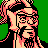 Pixelated 48x48 static icon of a character with long hair, glasses, and beard against green background.