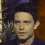 Four- of a person with dark hair in various poses against a blurred background, showing subtle facial expression changes