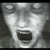 Pixelated grayscale face with wide-open mouth and closed eyes on left; green background with bright green text 'Original Icons .com' on right.