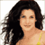 Static pixelated image of a woman with long dark hair wearing a yellow strap top against a white background.