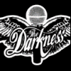 Animated sequence showing a person with long hair and sunglasses in various poses against a cloudy sky background, alternating with black-and-white 'The Darkness' logo frames.