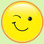 Yellow circular icon with orange border showing a winking face with one eye closed and a curved smile.