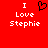 Red background with white text reading "I Love Stephanie" and a black pixelated heart symbol above the word "Love" on both sides of the image.