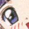 Anime-style character face with wide blue eyes, red blush marks on cheeks, open mouth showing pink tongue and teeth, purple hair strands visible.