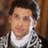 Pixelated image of a person with a neck brace and patterned shirt, surrounded by pixelated text reading 'screw Norman', 'i found', 'my Prince Charming' on black background.