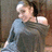 A person in a gray off-shoulder top appears in three showing slight head and body movement against a brown background