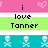 Pixelated text and symbols on a multi-colored background with heart and skull motifs.