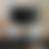 A pixelated grayscale gradient image with no discernible subjects or objects, featuring soft transitions between light and dark tones across a square frame.