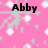 Pink background with white and gray pixelated shapes; black text reads 'Abby' on left and 'Soccer 24/7' on right.