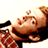 Pixelated static image of a person with light brown hair lying on their back, wearing dark clothing and red patterned fabric, against a white background.