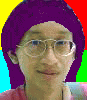 A person with purple hair and glasses appears in four color-blocked backgrounds, each showing a different sequence of red, yellow, green, and cyan sections.