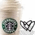 Starbucks cup with green circular logo and two black heart outlines on white background.