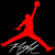 Red silhouette of a basketball player mid-jump with one arm raised, set against black background and featuring gray pixelated text below.