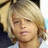 A static image shows a person with light brown hair and a white shirt, accompanied by pink text reading Mrs. Cole Sprouse.