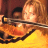 A pixelated image shows a person with light brown hair holding a violin bow, wearing a yellow top, with 'KILL BILL' text in yellow on black background.