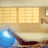 Pixelated animation of a figure on a blue exercise bike in a room with -patterned windows and wooden furniture