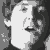 A black-and-white animated sequence shows a person's face transitioning through multiple expressions and poses