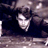 Static 48x48 pixel icon showing a low-resolution grayscale image of a person's face with dark hair against a dark background, rendered in a blocky, pixelated style typical of early internet graphics.