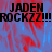 Pixelated text 'JADEN ROCKZZ!!!' repeated across a blue and red abstract background with visible pixelation.