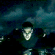 identical figures in dark clothing against a blue-toned background with light streaks, each figure's head position shifts slightly across frames