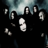 Group of people in dark clothing against smoky background with varying poses and expressions across frames.