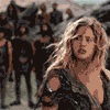 pixelated character portraits from a fantasy film, showing varied expressions and actions including raised weapons and group formations